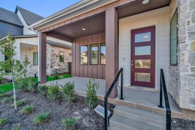 a view of front door of house with stairs