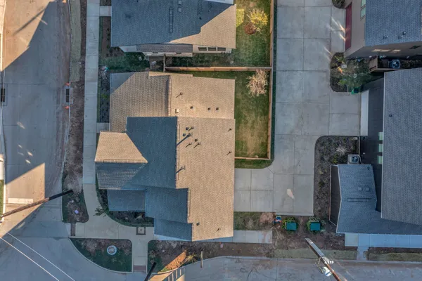 an aerial view of residential houses with outdoor space