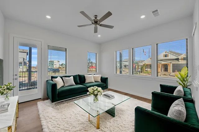 a living room with furniture and windows