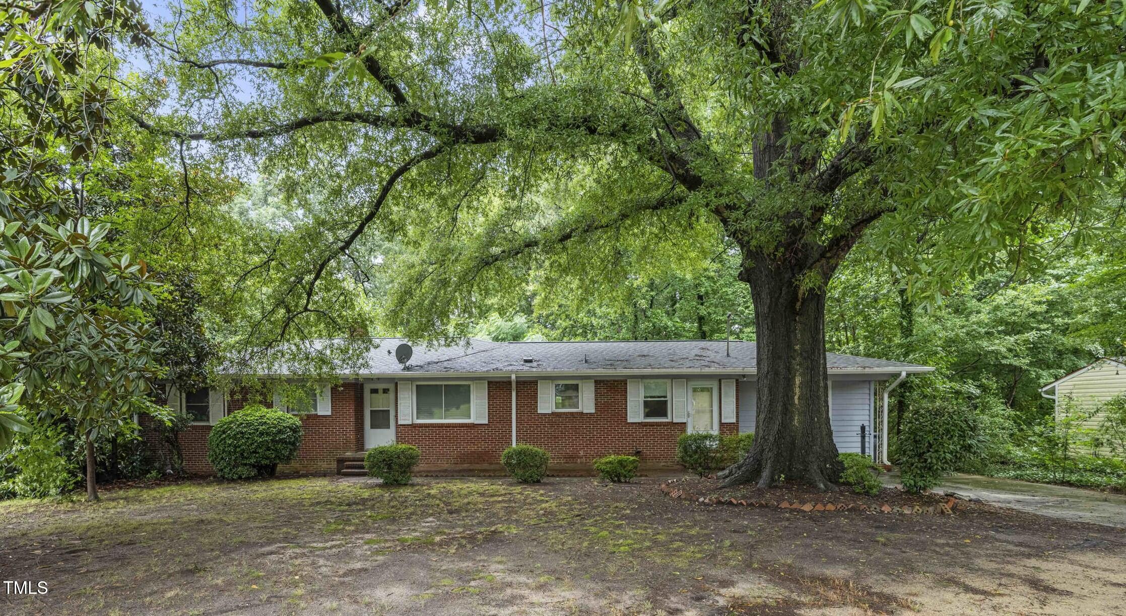 3721 Baugh Street Raleigh, NC 27604 - Photo 1 of 11 front view of a house with a trees