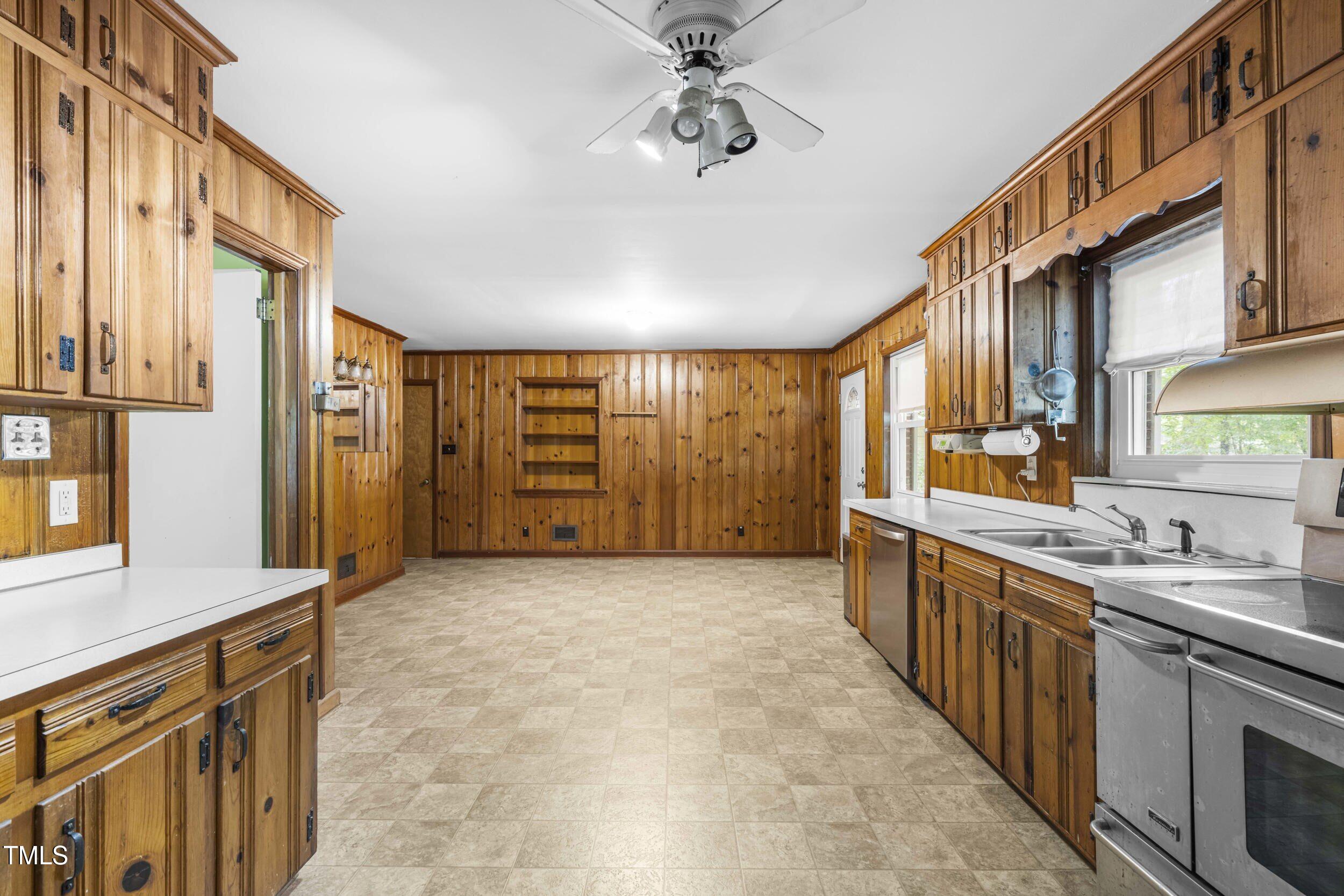 3721 Baugh Street Raleigh, NC 27604 - Photo 3 of 11 a view of a kitchen with a sink and cabinets