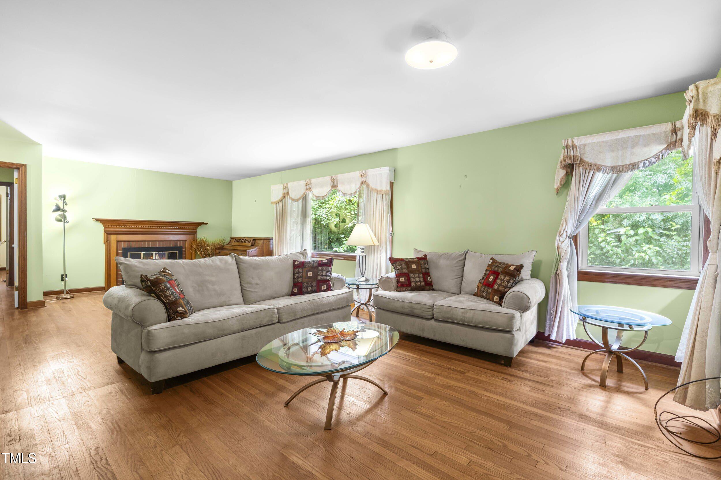 3721 Baugh Street Raleigh, NC 27604 - Photo 4 of 11 a living room with furniture and a large window