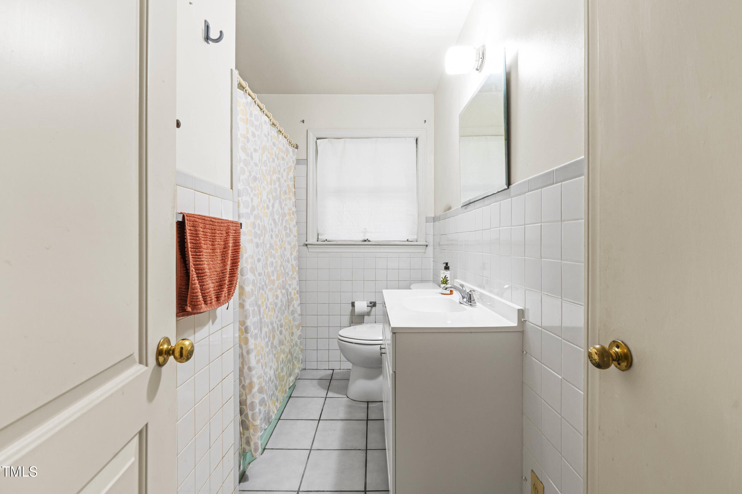 3721 Baugh Street Raleigh, NC 27604 - Photo 8 of 11 a bathroom with a sink toilet and shower