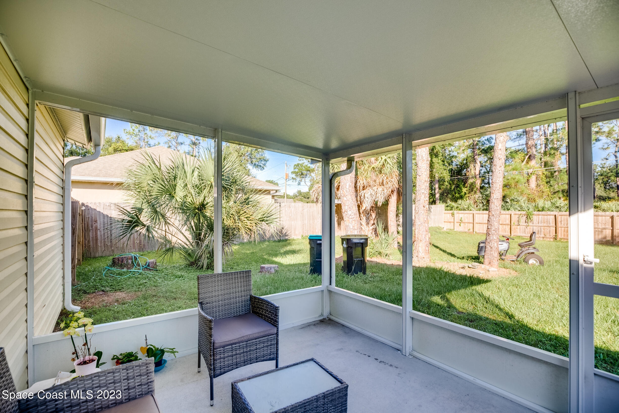 911 Thompson Road Southwest Palm Bay, FL 32908 - Photo 13 of 19 a view of a floor to ceiling window and a yard
