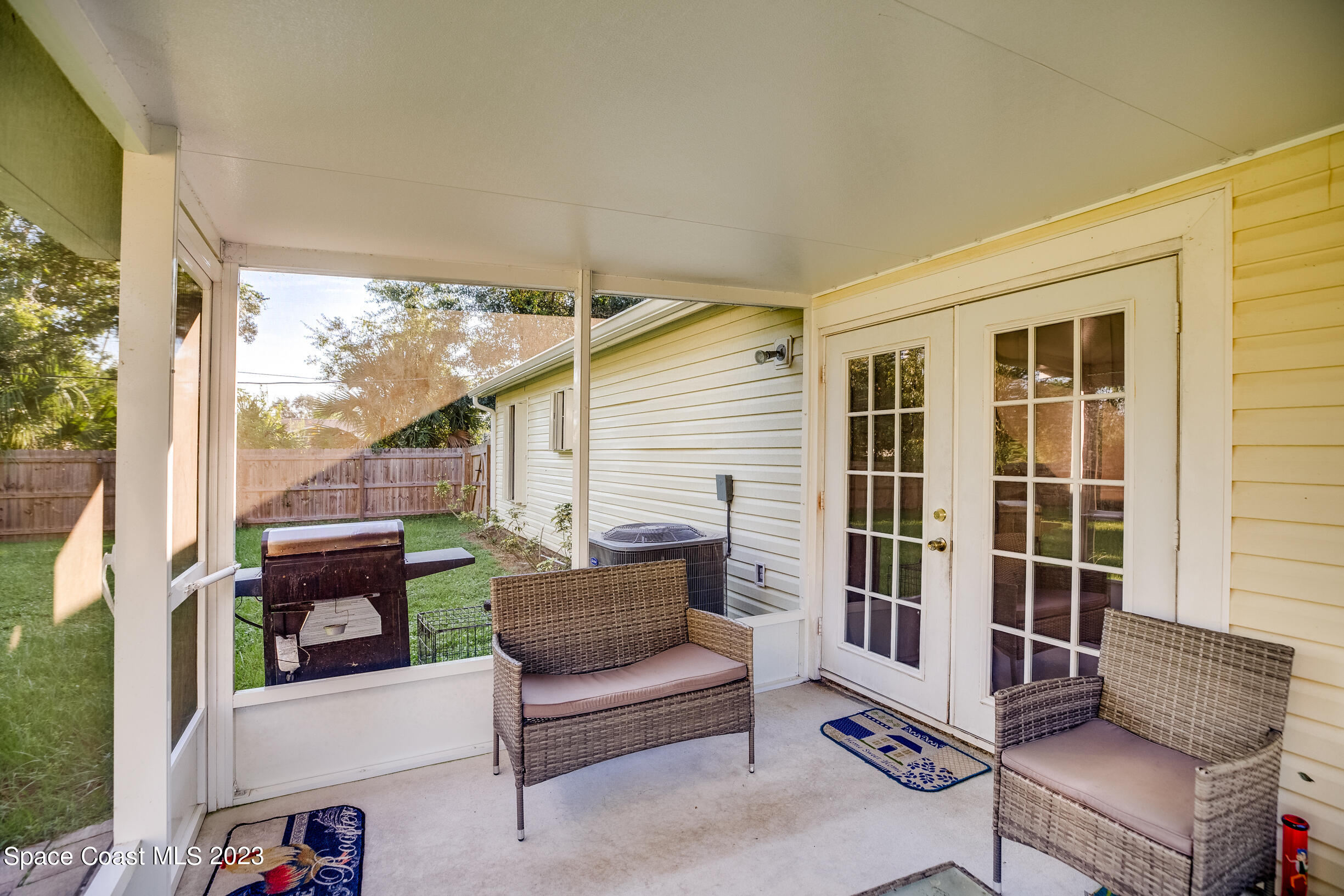 911 Thompson Road Southwest Palm Bay, FL 32908 - Photo 14 of 19 a building outdoor space with patio furniture