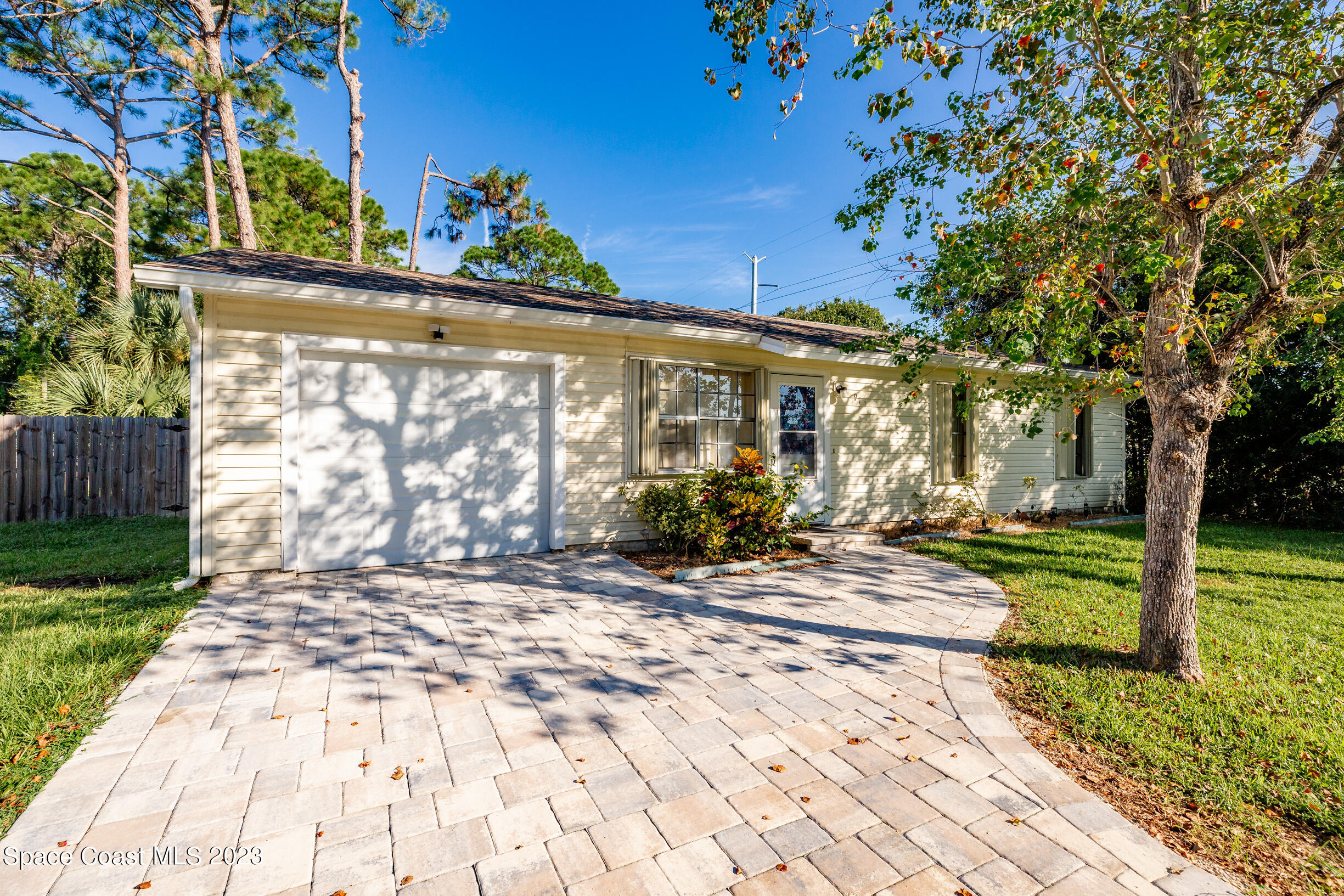 911 Thompson Road Southwest Palm Bay, FL 32908 - Photo 18 of 19 a view of a house with a patio