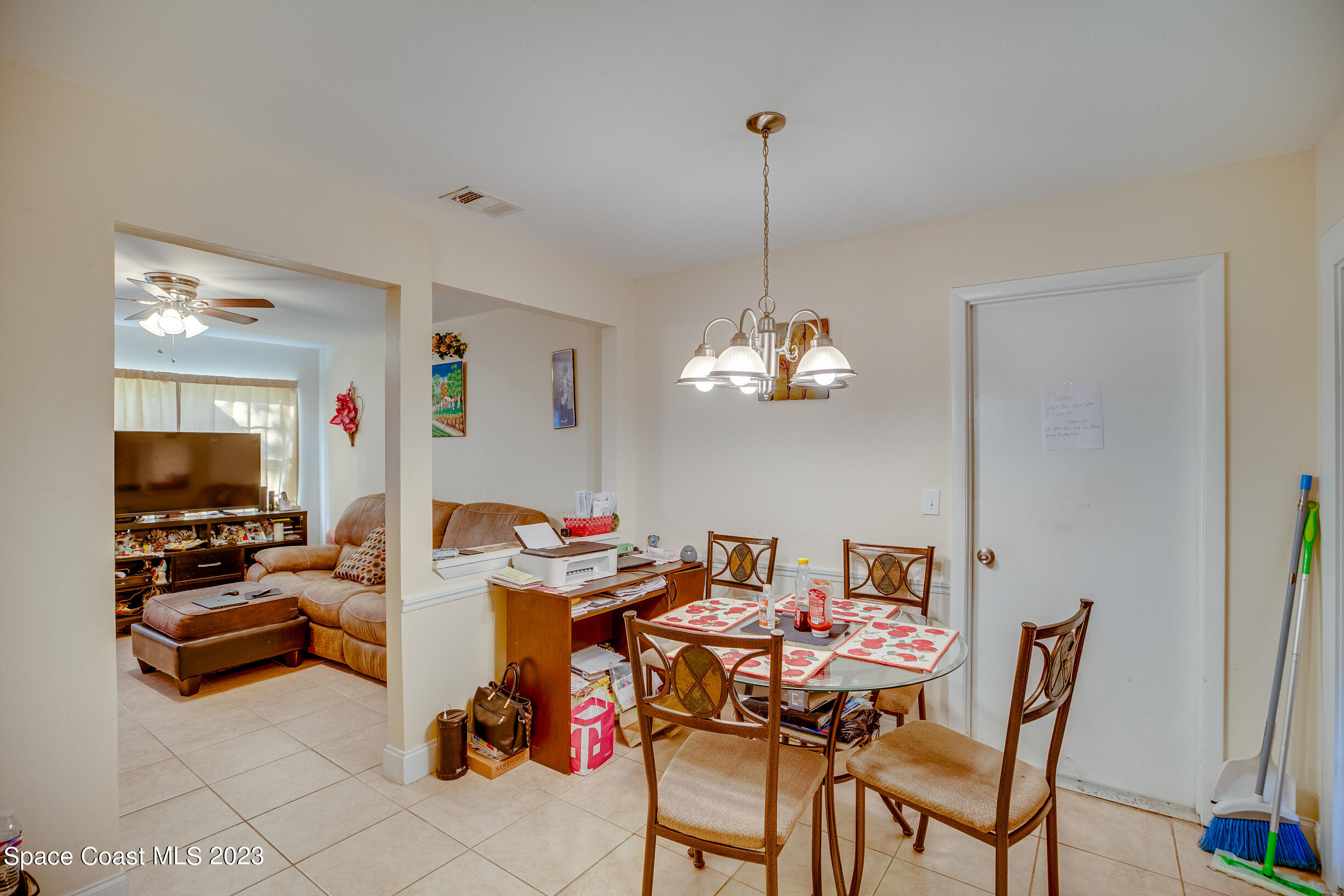 911 Thompson Road Southwest Palm Bay, FL 32908 - Photo 6 of 19 a view of a dining room with furniture