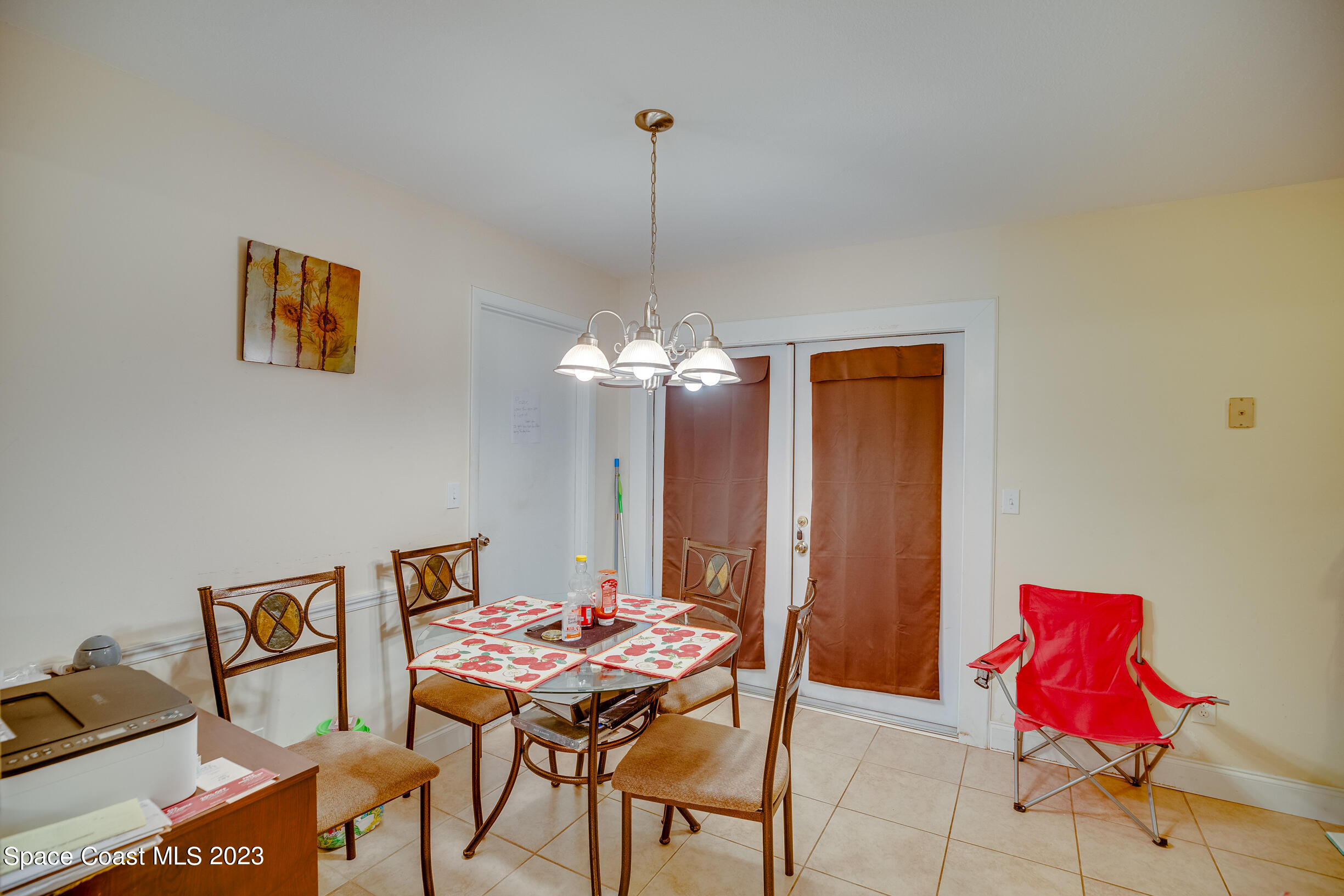 911 Thompson Road Southwest Palm Bay, FL 32908 - Photo 8 of 19 a dining room with furniture and window
