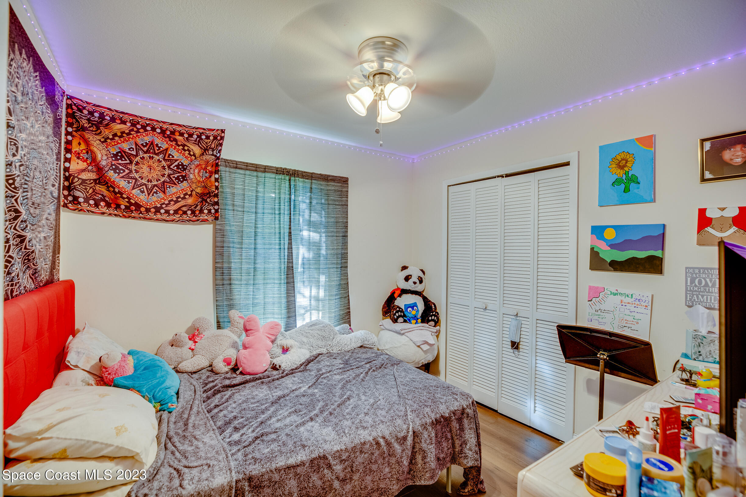 911 Thompson Road Southwest Palm Bay, FL 32908 - Photo 9 of 19 a bed room with a bed and a window