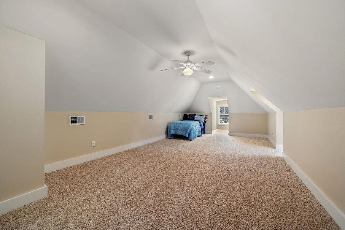 452 Falling Water Road Spring Lake, NC 28390 - Photo 33 of 93 a view of a livingroom with a ceiling fan and chandelier fan