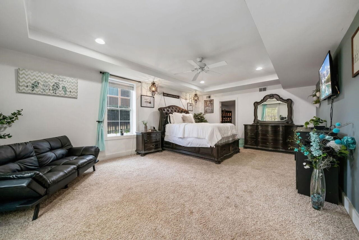 452 Falling Water Road Spring Lake, NC 28390 - Photo 49 of 93 a spacious bedroom with a bed couch and a window
