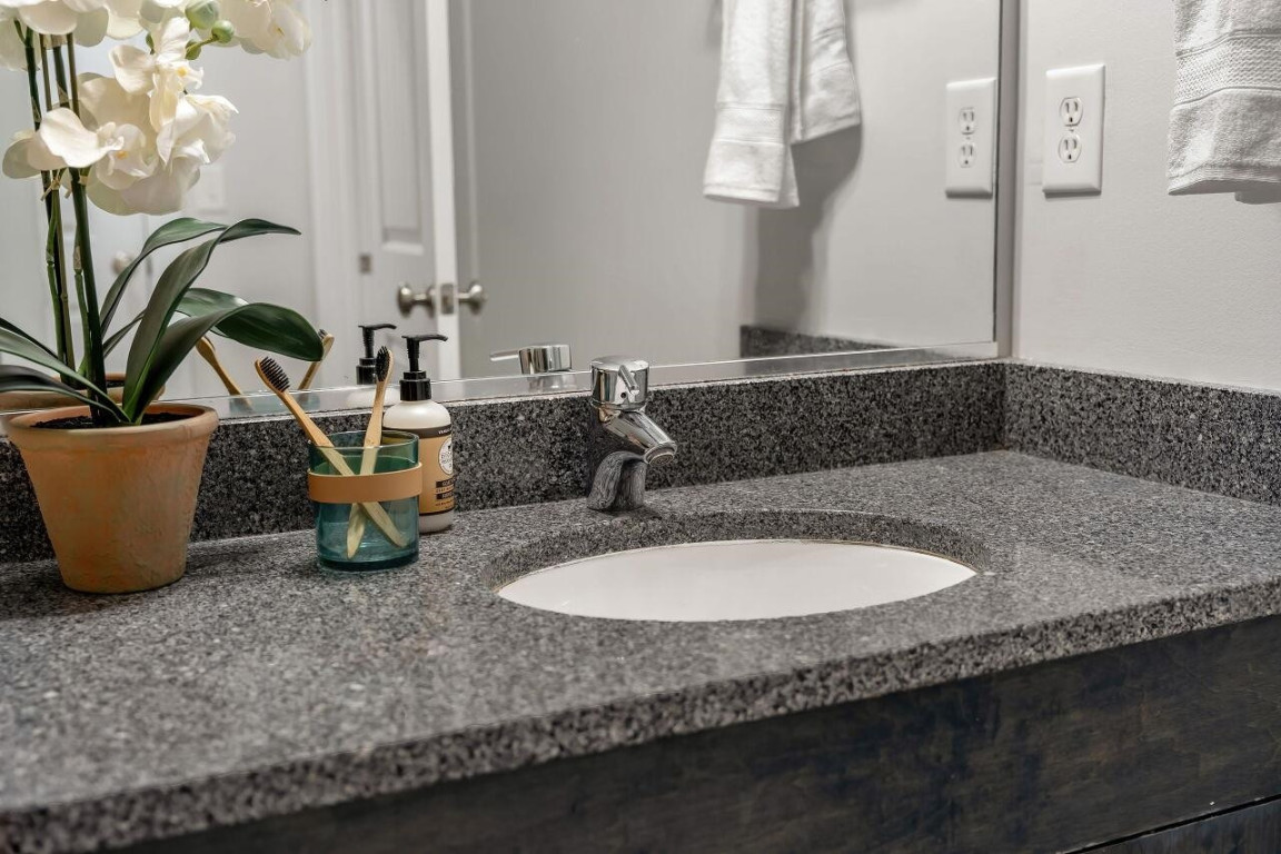 452 Falling Water Road Spring Lake, NC 28390 - Photo 61 of 93 a bathroom with a granite countertop sink a mirror and bathtub