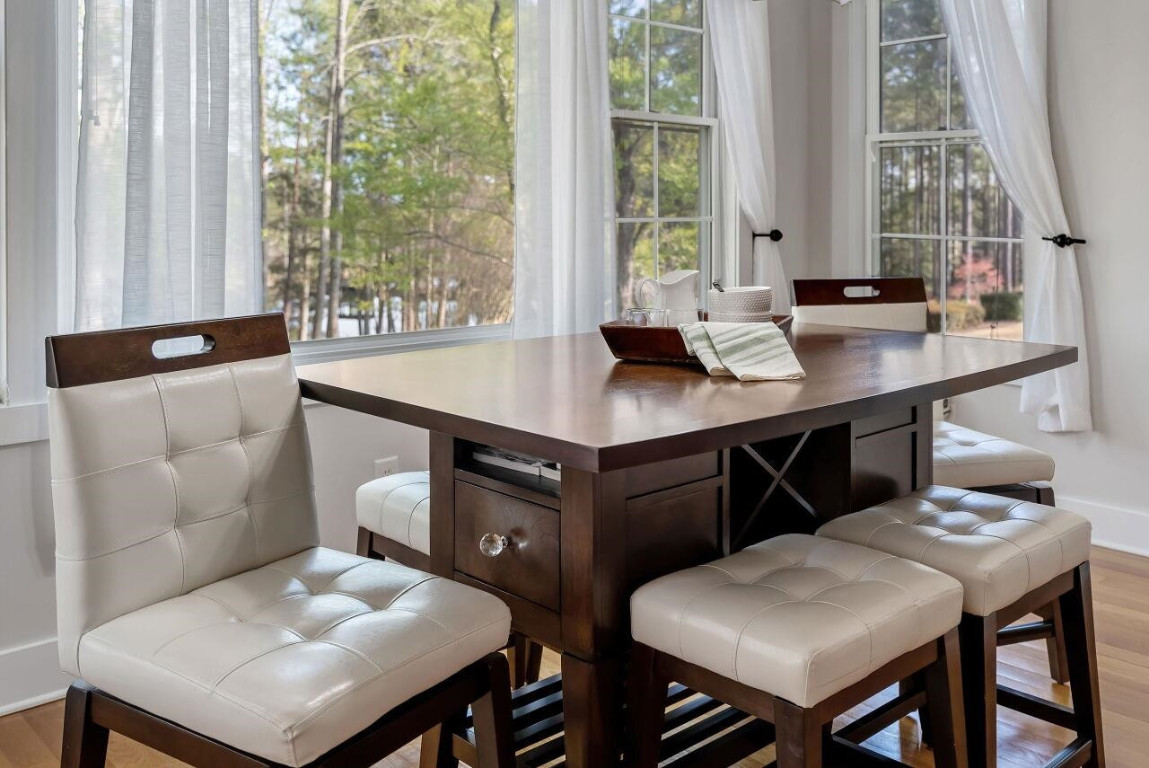 452 Falling Water Road Spring Lake, NC 28390 - Photo 63 of 93 a kitchen with a table chairs and window