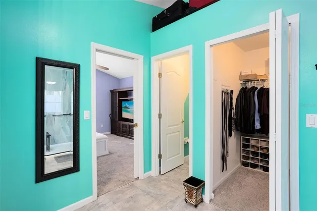 a view of a livingroom with wooden floor and a balcony