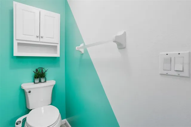 a bathroom with a toilet and a sink