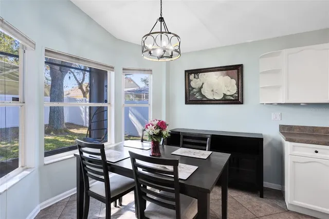 a dining room with furniture and window