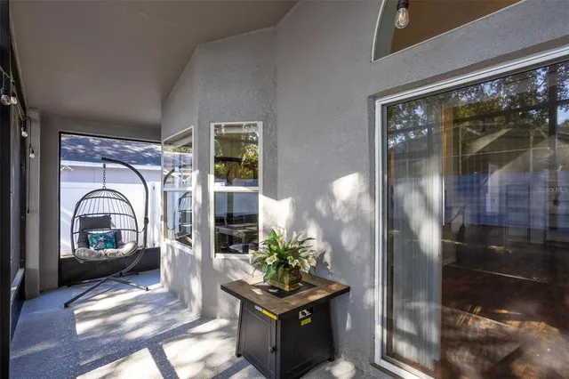 a living room with furniture a garden and a potted plant
