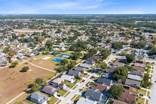 an aerial view of residential houses with outdoor space