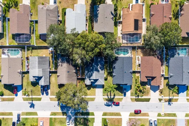a aerial view of multi story residential apartment building with yard