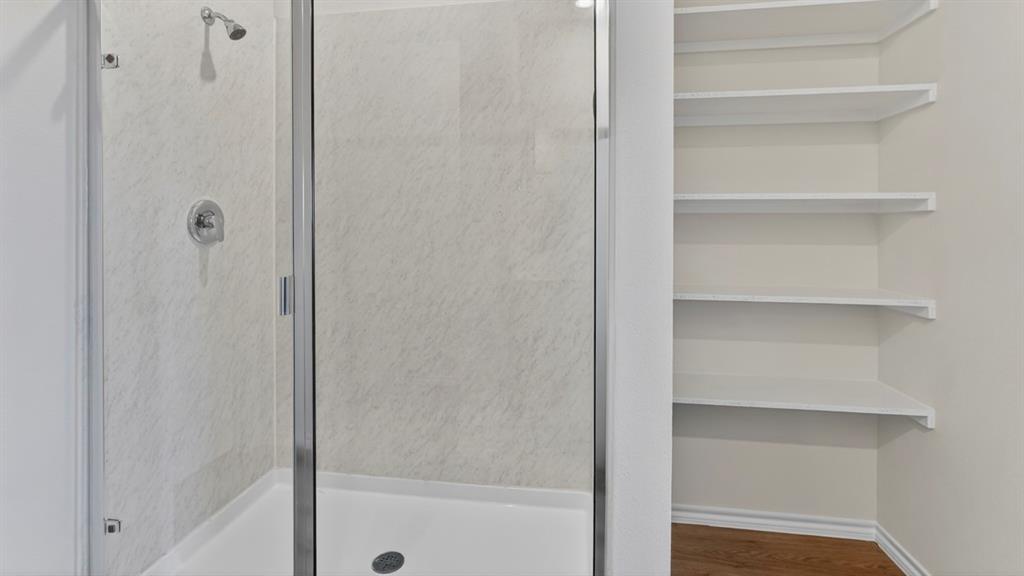 1683 Mantle Road Crandall, TX 75114 - Photo 21 of 31 Glass-enclosed shower with a chrome shower head and control