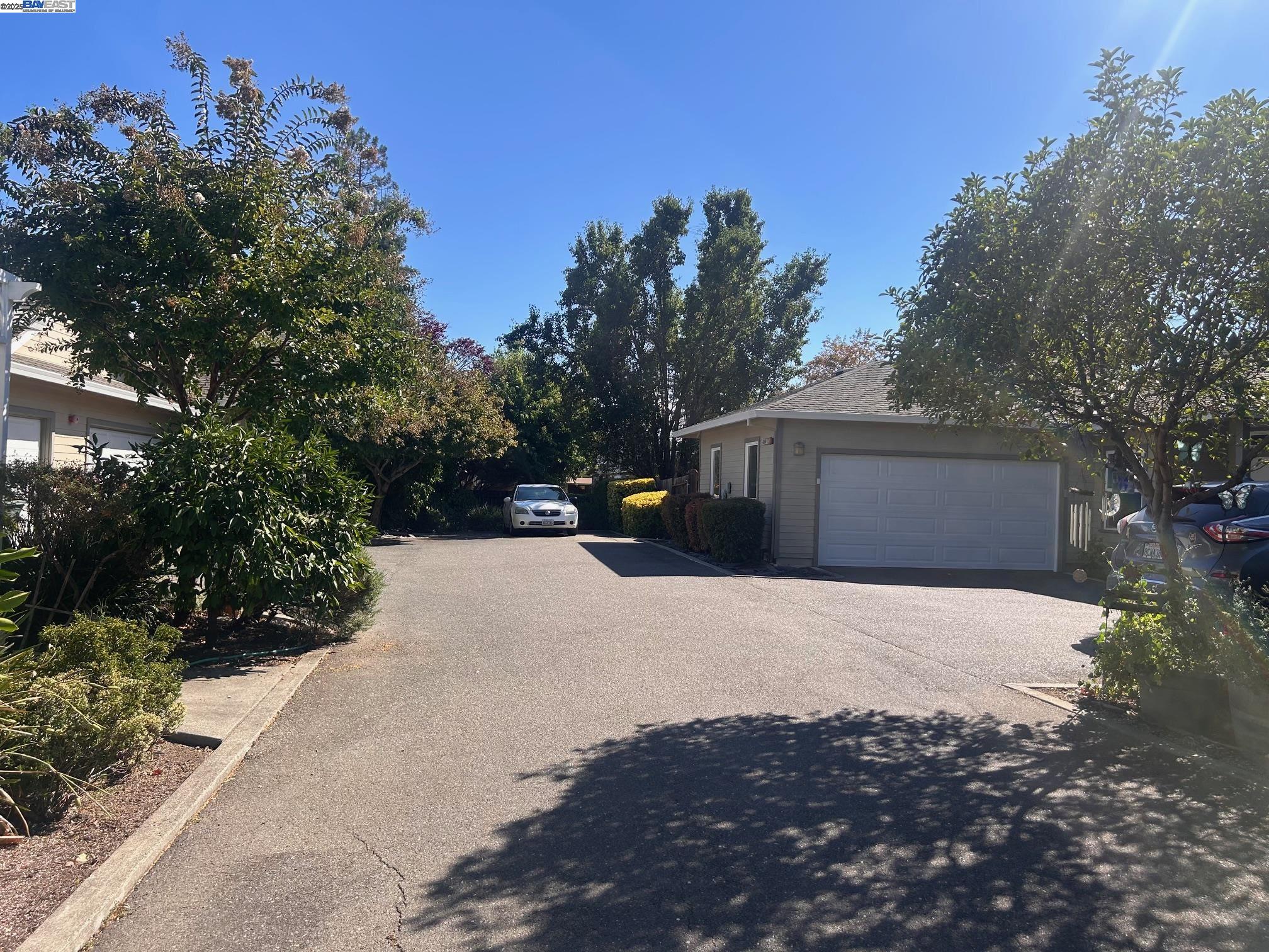 426 Piper Street, Unit D Healdsburg, CA 95448 - Photo 2 of 10 a front view of a house with a yard and garage