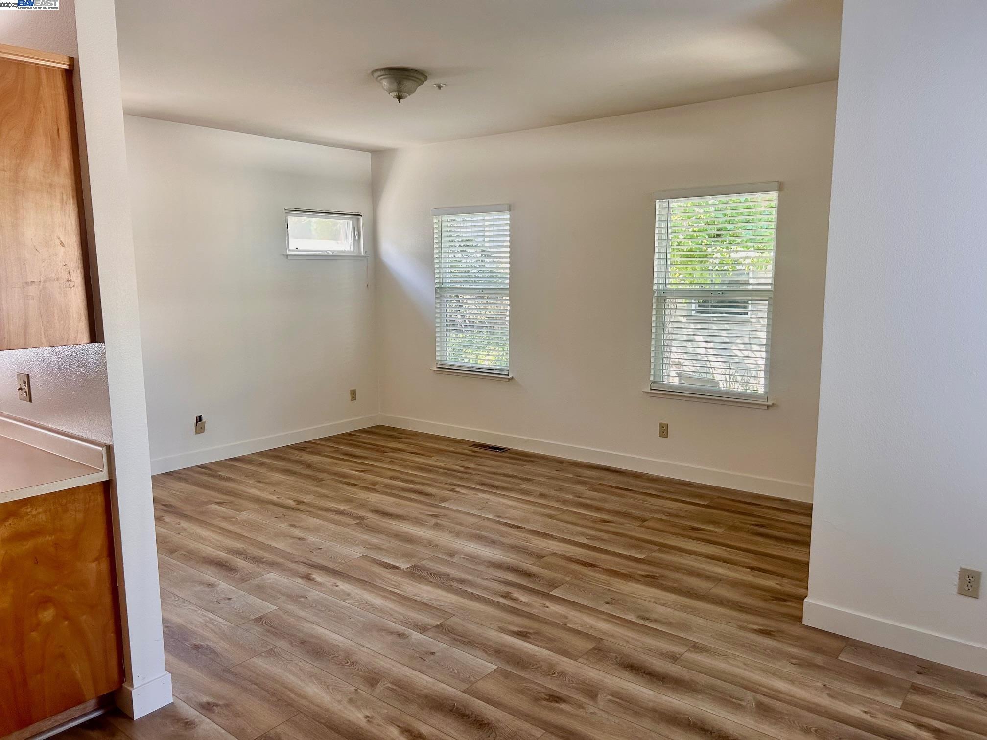 426 Piper Street, Unit D Healdsburg, CA 95448 - Photo 5 of 10 a view of a room with wooden floor and windows