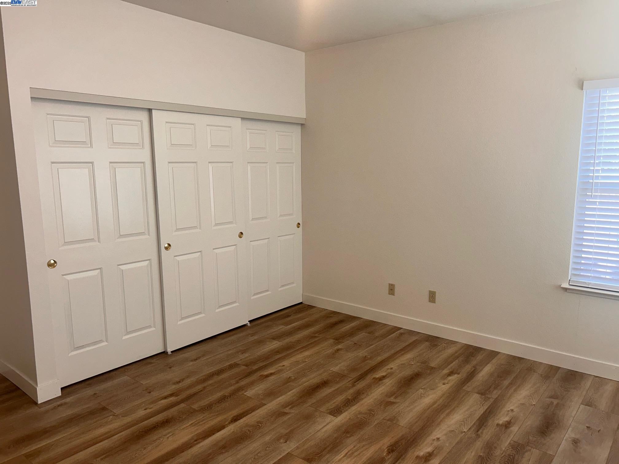 426 Piper Street, Unit D Healdsburg, CA 95448 - Photo 6 of 10 a view of an empty room with wooden floor