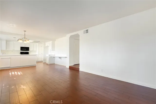 a view of a kitchen with a sink and a stove