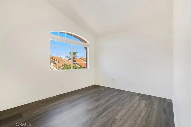 a view of room with wooden floor and window