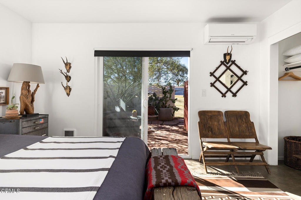 7284 Saddleback Road Joshua Tree, CA 92252 - Photo 14 of 47 a living room with furniture and a window