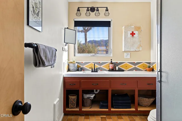 a bathroom with a sink and a mirror