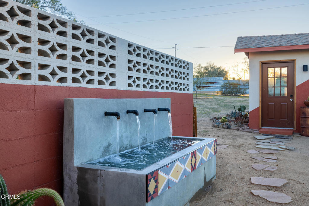 7284 Saddleback Road Joshua Tree, CA 92252 - Photo 28 of 47 a kitchen with stainless steel appliances granite countertop a stove and a sink