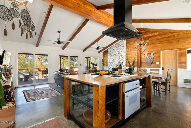a kitchen with a stove and cabinets