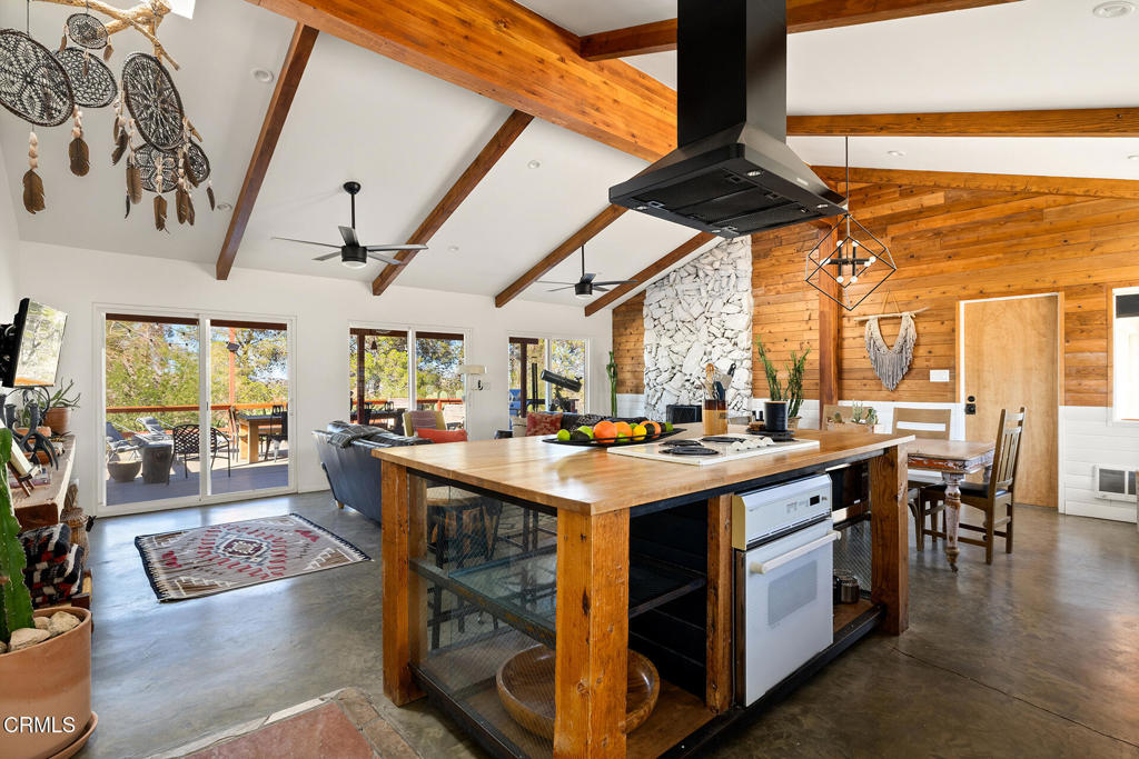 7284 Saddleback Road Joshua Tree, CA 92252 - Photo 3 of 47 a kitchen with a stove and cabinets