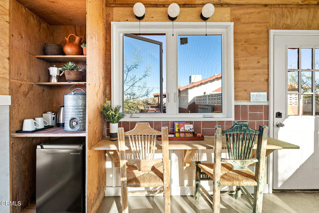 7284 Saddleback Road Joshua Tree, CA 92252 - Photo 31 of 47 a view of front door of house with a dining area