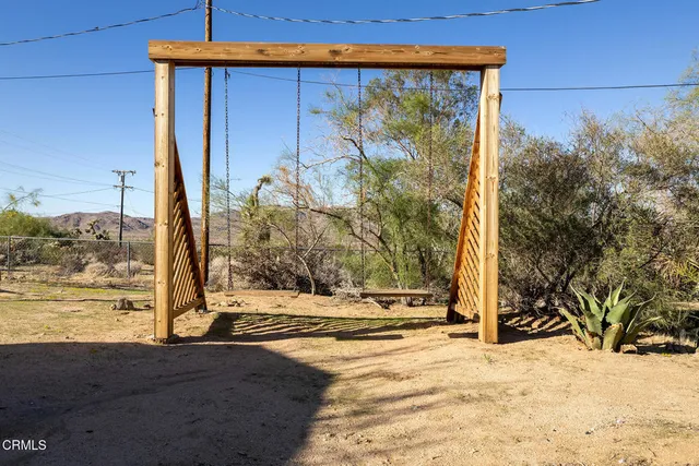 a view of a backyard of the house