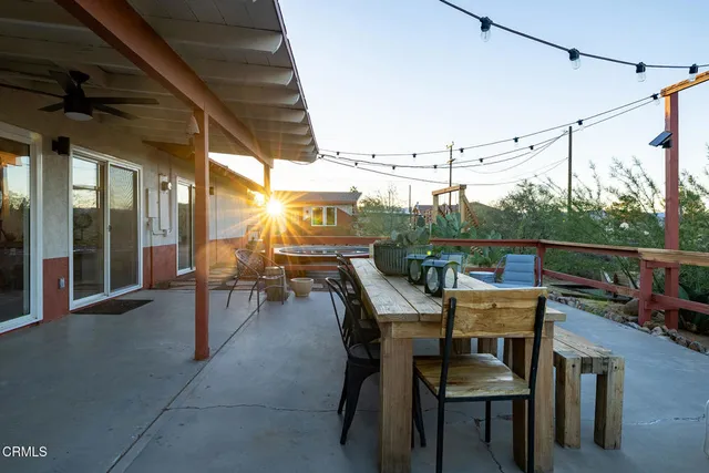 a view of a chairs and table in a patio