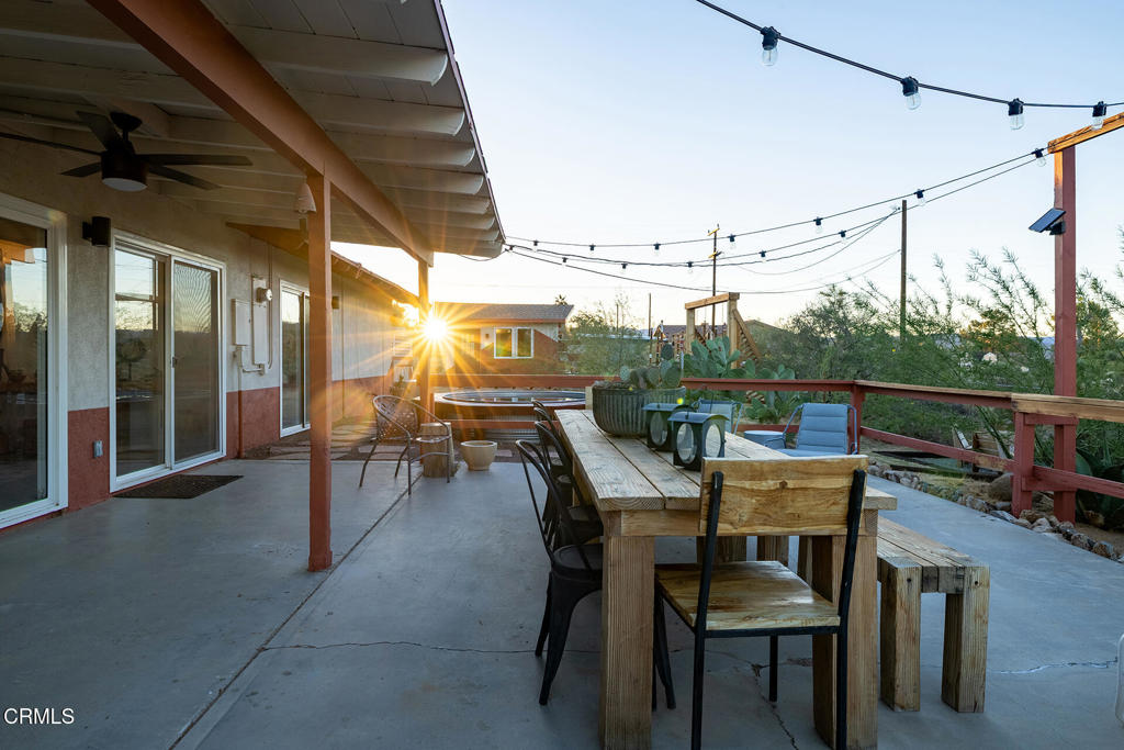 7284 Saddleback Road Joshua Tree, CA 92252 - Photo 38 of 47 a view of a chairs and table in a patio