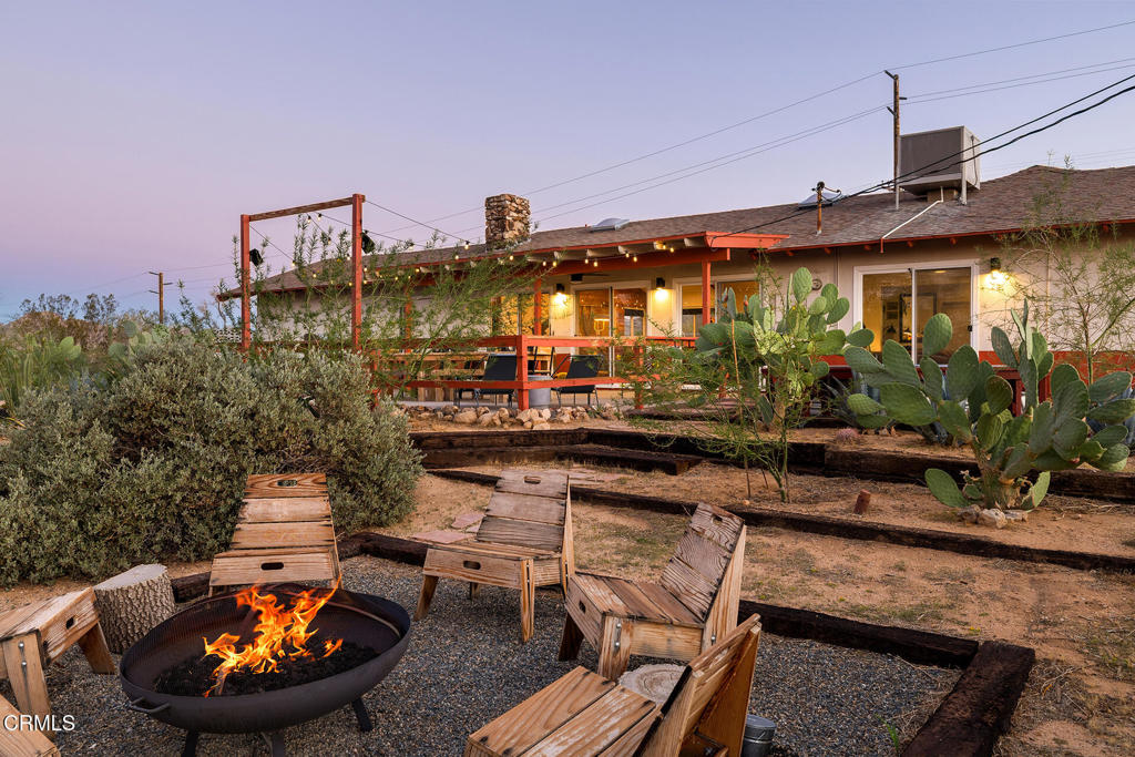 7284 Saddleback Road Joshua Tree, CA 92252 - Photo 39 of 47 a view of a house with swimming pool and furniture