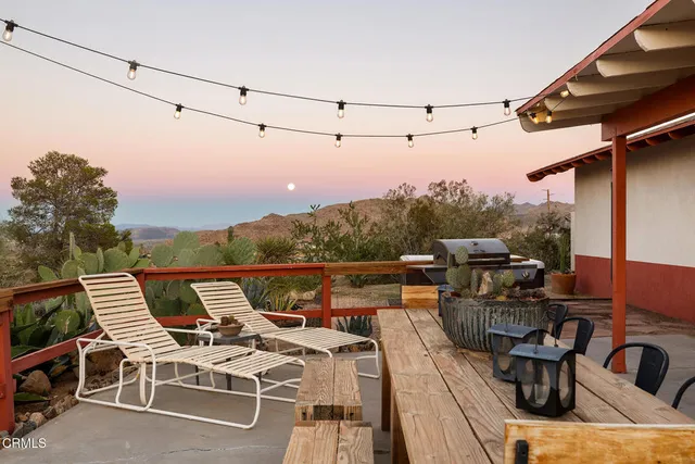 a view of a terrace with furniture