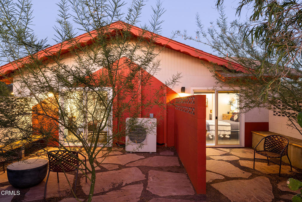 7284 Saddleback Road Joshua Tree, CA 92252 - Photo 43 of 47 a backyard of a house with table and chairs