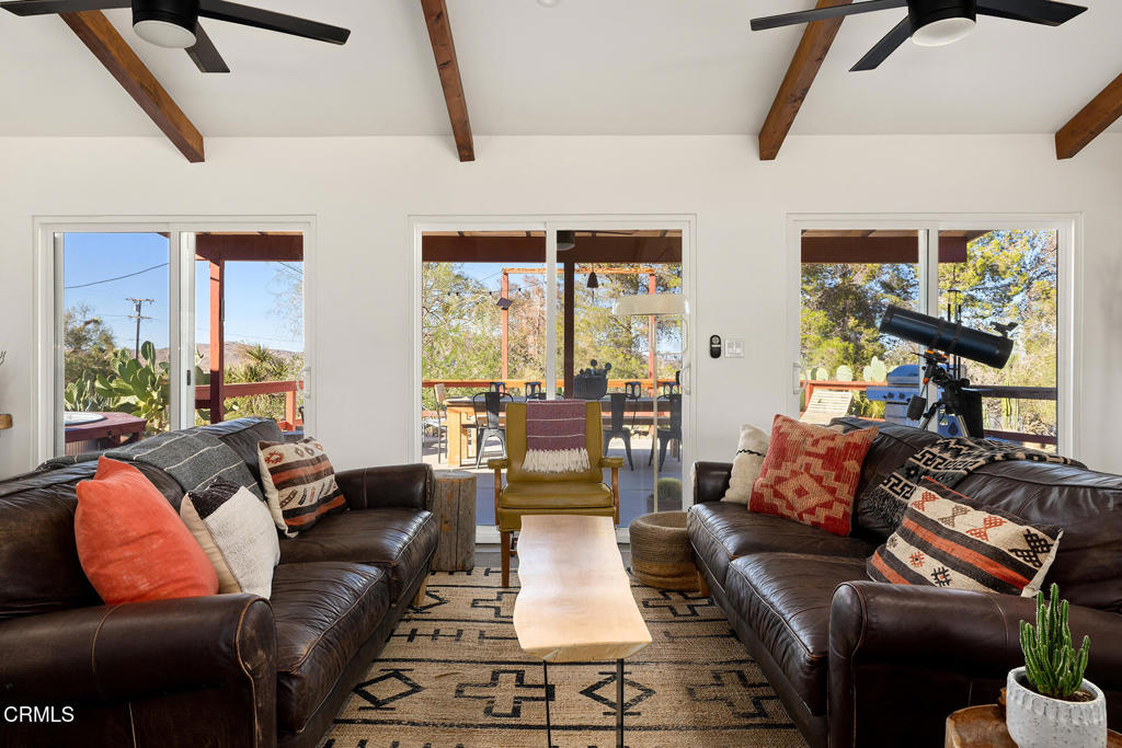 7284 Saddleback Road Joshua Tree, CA 92252 - Photo 5 of 47 a living room with furniture and a large window