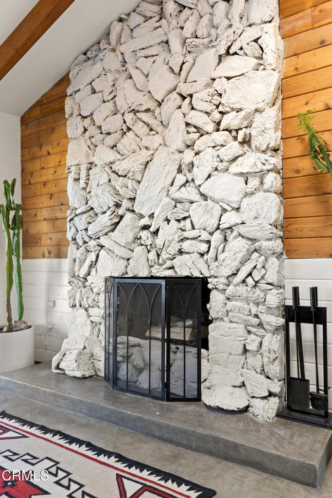 7284 Saddleback Road Joshua Tree, CA 92252 - Photo 6 of 47 a view of a fireplace with wooden floor
