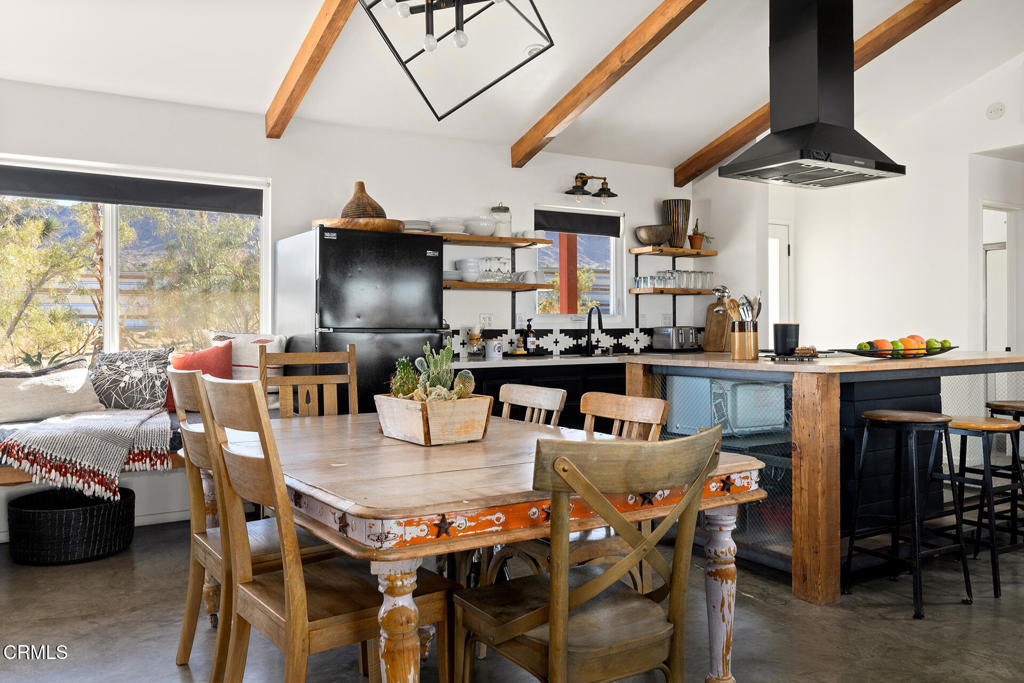 7284 Saddleback Road Joshua Tree, CA 92252 - Photo 8 of 47 a view of a dining room with furniture window and outside view