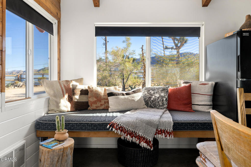 7284 Saddleback Road Joshua Tree, CA 92252 - Photo 9 of 47 a living room with furniture and a large window