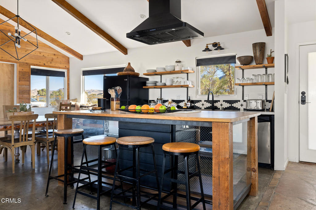 7284 Saddleback Road Joshua Tree, CA 92252 - Photo 10 of 47 a kitchen with a table and chairs in it
