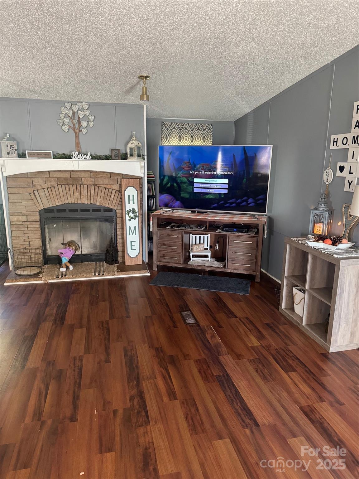456 Cornelius Road Mooresville, NC 28117 - Photo 13 of 19 a living room with furniture and a fireplace