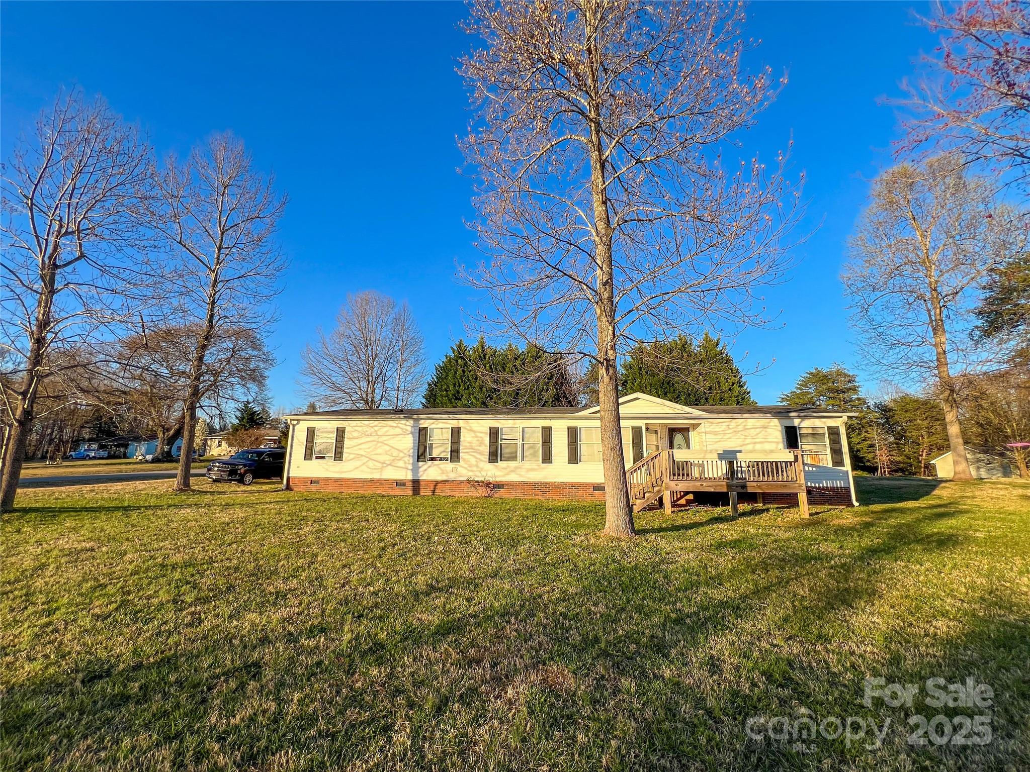456 Cornelius Road Mooresville, NC 28117 - Photo 6 of 19 a view of a house with a yard