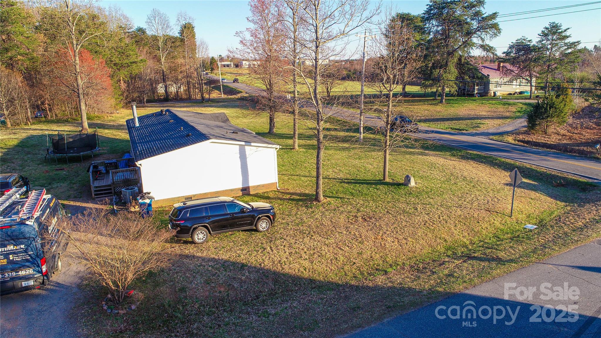 456 Cornelius Road Mooresville, NC 28117 - Photo 10 of 19 a park view with a bench and trees