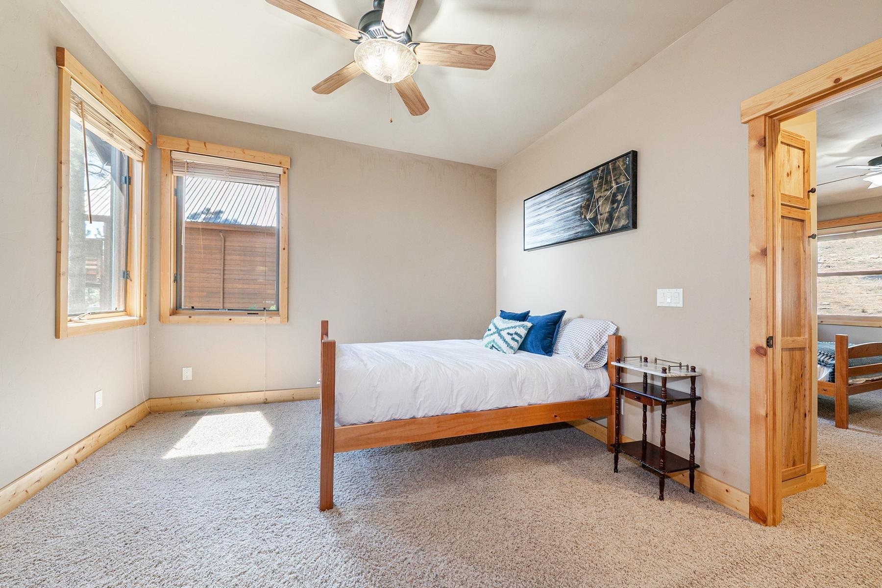 14070 Alder Creek Road Truckee, CA 96161 - Photo 15 of 28 a bed room with a bed and a window